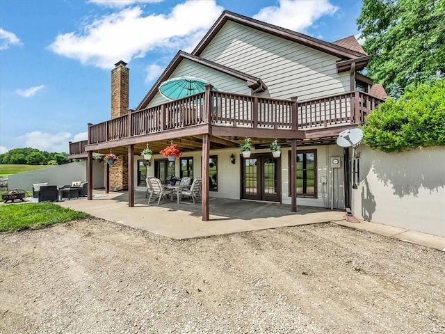 12806 33rd Hwy, Kearney, MO 64060 - back of house with a deck and a patio area