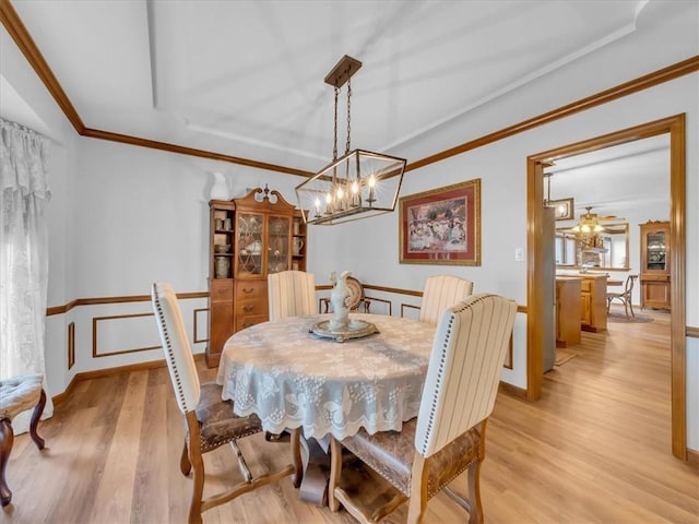 12806 33rd Hwy, Kearney, MO 64060 - dining room with a chandelier, light wood finished floors, and ornamental molding