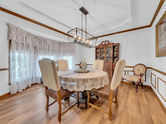 12806 33rd Hwy, Kearney, MO 64060 - dining area with a chandelier, light wood-style flooring, ornamental molding, a raised ceiling, and baseboards