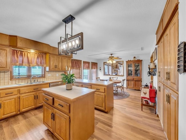 12806 33rd Hwy, Kearney, MO 64060 - kitchen with a sink, a center island, light countertops, and tasteful backsplash