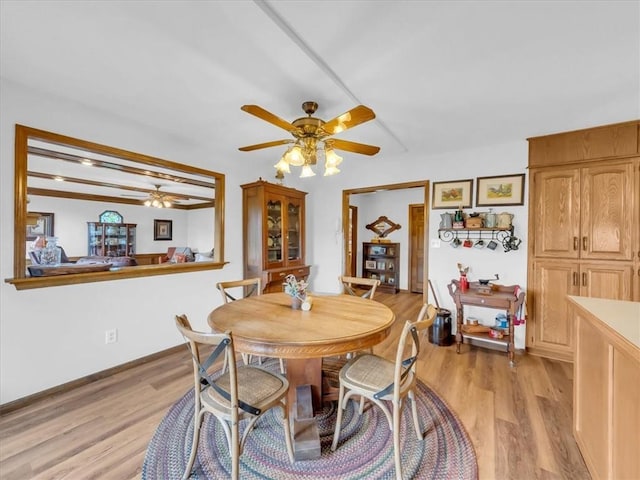 12806 33rd Hwy, Kearney, MO 64060 - dining space featuring ceiling fan, light wood-style floors, and baseboards