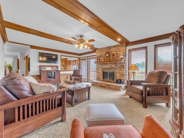 12806 33rd Hwy, Kearney, MO 64060 - carpeted living area with a fireplace, beam ceiling, ornamental molding, and ceiling fan