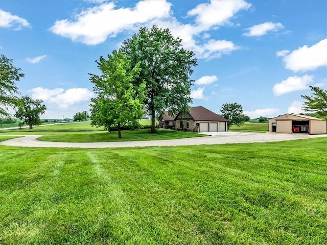 12806 33rd Hwy, Kearney, MO 64060 - view of green lawn featuring a garage, gravel driveway, and an outbuilding
