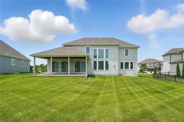 17137 Barton St, Overland Park, KS 66221 - back of property with a patio area and roof with shingles