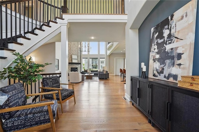 17137 Barton St, Overland Park, KS 66221 - foyer entrance featuring a high ceiling, hardwood / wood-style flooring, stairway, and recessed lighting
