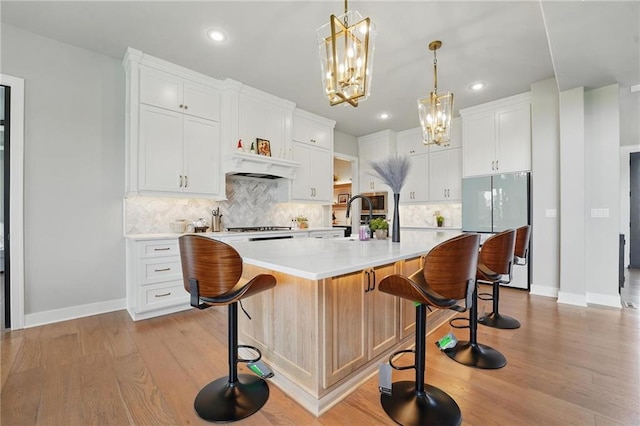 17137 Barton St, Overland Park, KS 66221 - kitchen featuring freestanding refrigerator, a chandelier, baseboards, recessed lighting, and light wood finished floors
