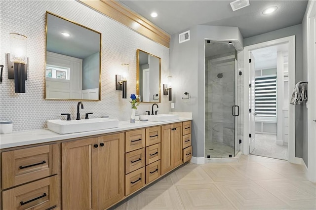 17137 Barton St, Overland Park, KS 66221 - bathroom featuring double vanity, a shower stall, and baseboards