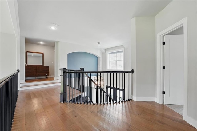 17137 Barton St, Overland Park, KS 66221 - hall with an upstairs landing, hardwood / wood-style flooring, baseboards, and recessed lighting