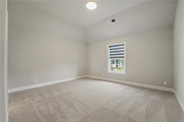 17137 Barton St, Overland Park, KS 66221 - spare room featuring lofted ceiling, carpet flooring, and baseboards