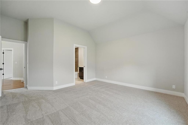 17137 Barton St, Overland Park, KS 66221 - empty room with light colored carpet, lofted ceiling, and baseboards