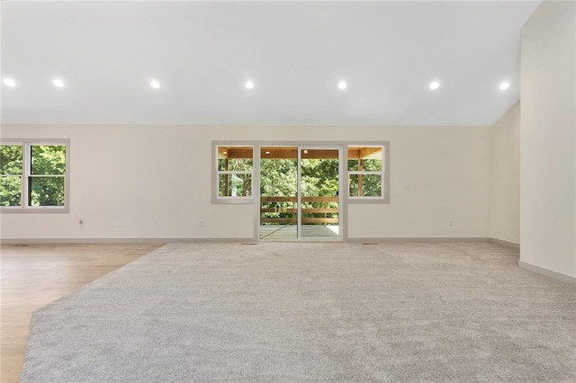 38 NW 525th Rd, Warrensburg, MO 64093 - spare room featuring recessed lighting, lofted ceiling, and light colored carpet