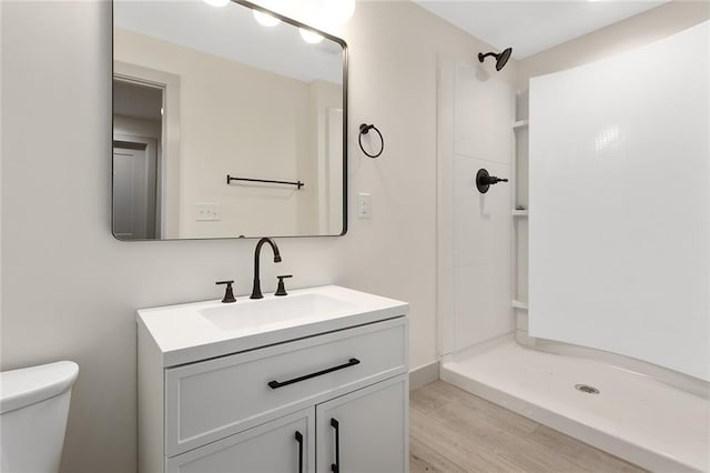 38 NW 525th Rd, Warrensburg, MO 64093 - bathroom featuring vanity, wood finished floors, and a shower