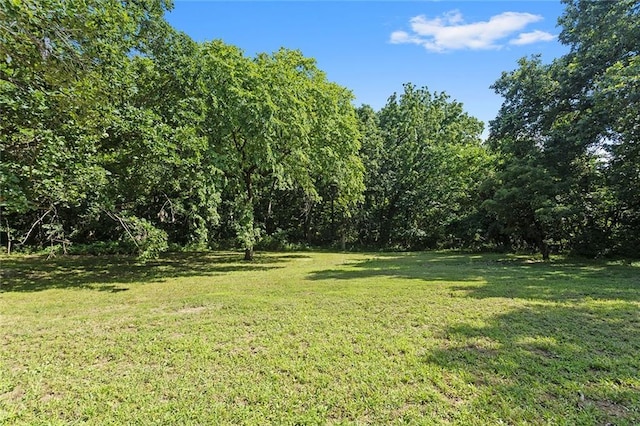 38 NW 525th Rd, Warrensburg, MO 64093 - view of grassy yard featuring a wooded view