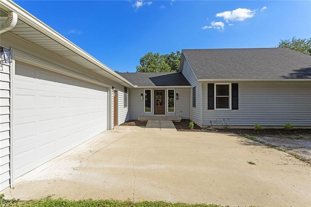 38 NW 525th Rd, Warrensburg, MO 64093 - view of front of home featuring concrete driveway, a garage, and roof with shingles