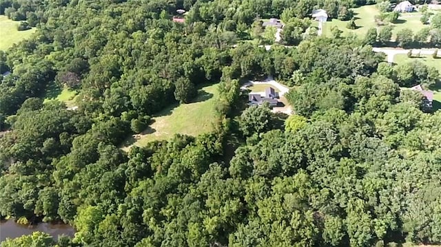 38 NW 525th Rd, Warrensburg, MO 64093 - aerial view of property and surrounding area featuring a heavily wooded area