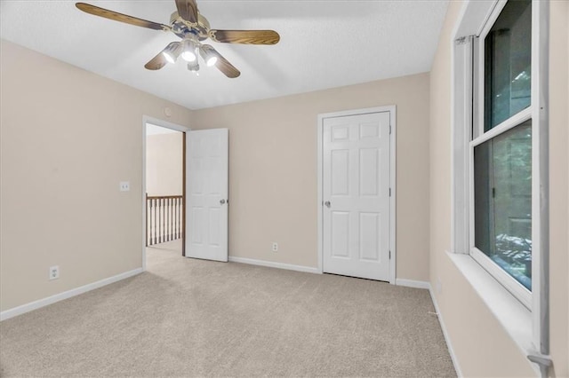 4506 NW Apache Dr, Riverside, MO 64150 - unfurnished bedroom featuring carpet floors, baseboards, and a ceiling fan