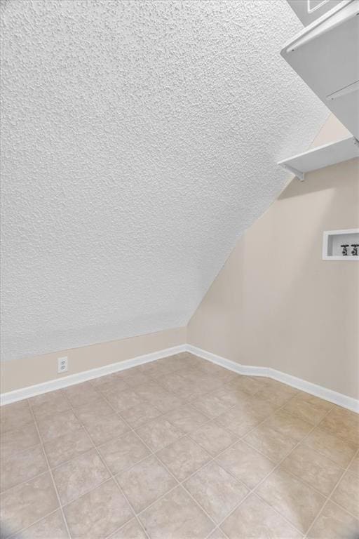 4506 NW Apache Dr, Riverside, MO 64150 - interior space featuring a textured ceiling, washer hookup, and baseboards