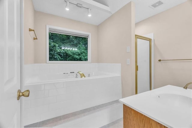 4506 NW Apache Dr, Riverside, MO 64150 - full bath featuring a garden tub, a shower stall, and vanity
