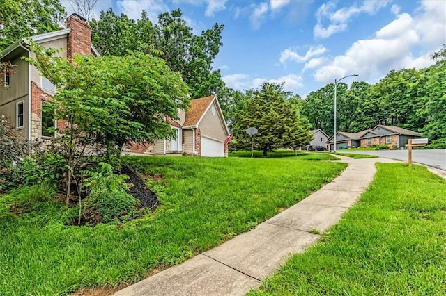 4506 NW Apache Dr, Riverside, MO 64150 - view of green lawn featuring a garage