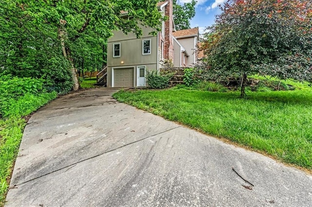 4506 NW Apache Dr, Riverside, MO 64150 - view of front of home featuring driveway and an attached garage