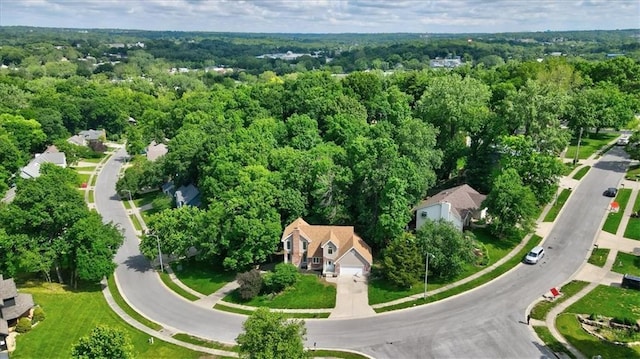 4506 NW Apache Dr, Riverside, MO 64150 - aerial view of property and surrounding area with a heavily wooded area