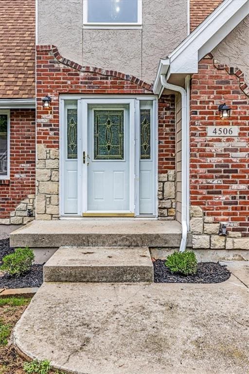 4506 NW Apache Dr, Riverside, MO 64150 - entrance to property featuring brick siding and stone siding