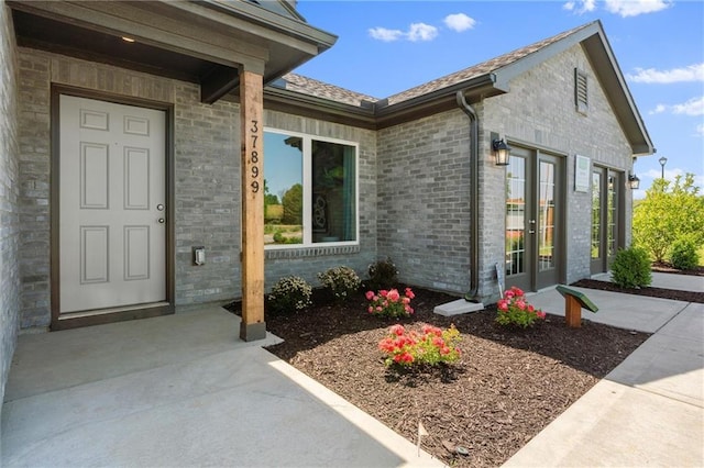 37838 W 208th Ter, Edgerton, KS 66021 - entrance to property featuring french doors and brick siding
