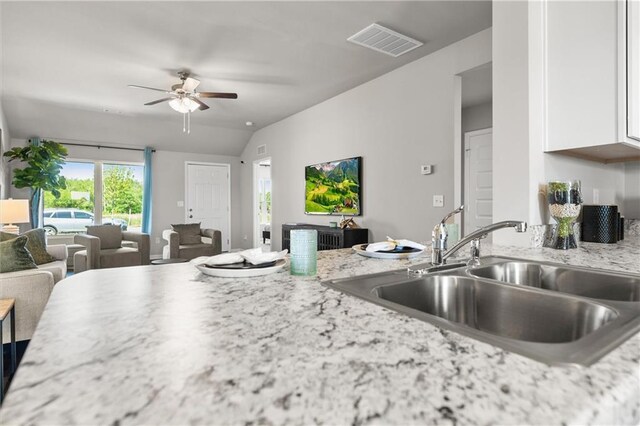 37838 W 208th Ter, Edgerton, KS 66021 - kitchen with a sink, open floor plan, white cabinetry, ceiling fan, and vaulted ceiling