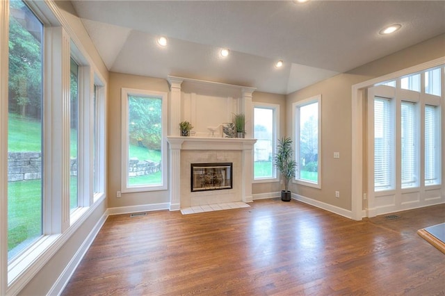 5706 NE Sapphire Pl, Lees Summit, MO 64064 - unfurnished living room with baseboards, dark wood-style floors, a fireplace, and recessed lighting