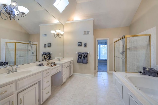 5706 NE Sapphire Pl, Lees Summit, MO 64064 - full bath with a chandelier, lofted ceiling, a shower stall, double vanity, and a garden tub