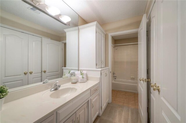 5706 NE Sapphire Pl, Lees Summit, MO 64064 - bathroom with vanity, tile patterned flooring, and tub / shower combination