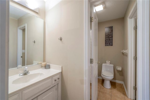 5706 NE Sapphire Pl, Lees Summit, MO 64064 - full bathroom with toilet, vanity, tile patterned floors, and baseboards