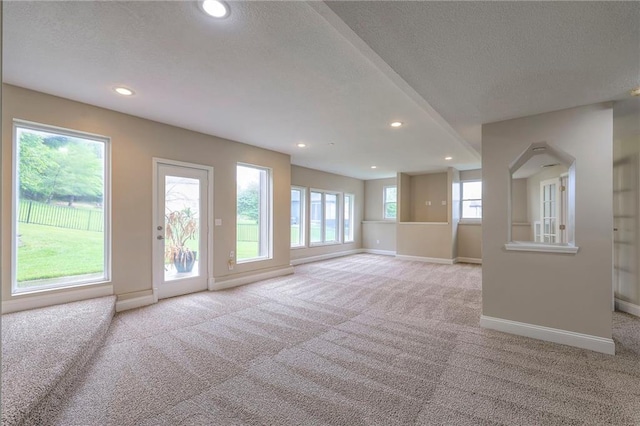 5706 NE Sapphire Pl, Lees Summit, MO 64064 - carpeted empty room featuring a textured ceiling, recessed lighting, and baseboards