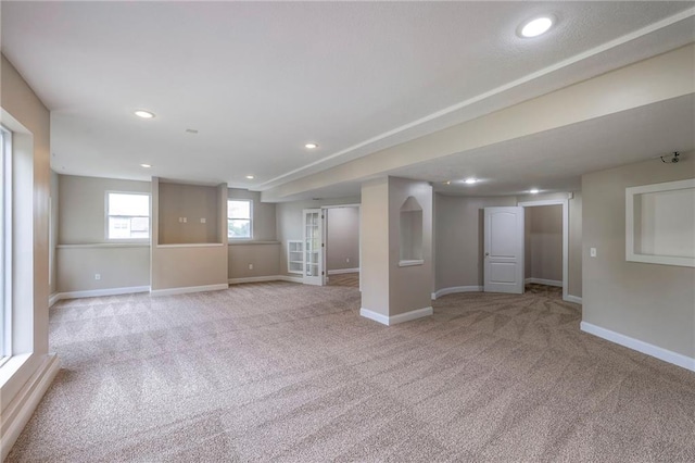 5706 NE Sapphire Pl, Lees Summit, MO 64064 - below grade area with light colored carpet, baseboards, and recessed lighting