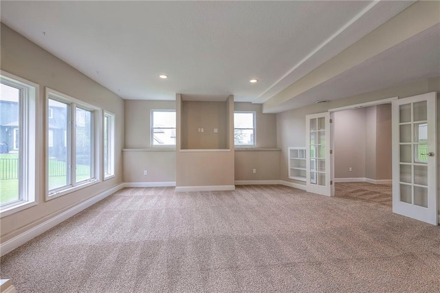 5706 NE Sapphire Pl, Lees Summit, MO 64064 - empty room with french doors, light carpet, baseboards, and recessed lighting