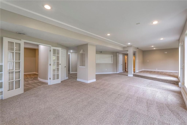 5706 NE Sapphire Pl, Lees Summit, MO 64064 - below grade area with french doors, carpet flooring, baseboards, and recessed lighting