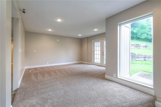 5706 NE Sapphire Pl, Lees Summit, MO 64064 - empty room with carpet, baseboards, french doors, and recessed lighting