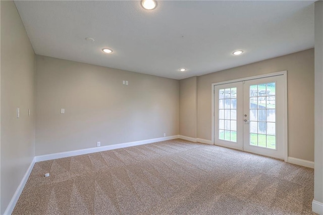 5706 NE Sapphire Pl, Lees Summit, MO 64064 - carpeted spare room featuring baseboards, french doors, and recessed lighting