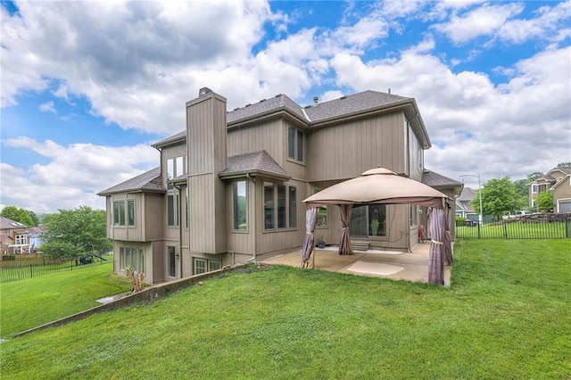 5706 NE Sapphire Pl, Lees Summit, MO 64064 - rear view of house with a gazebo, a patio area, a chimney, and a shingled roof