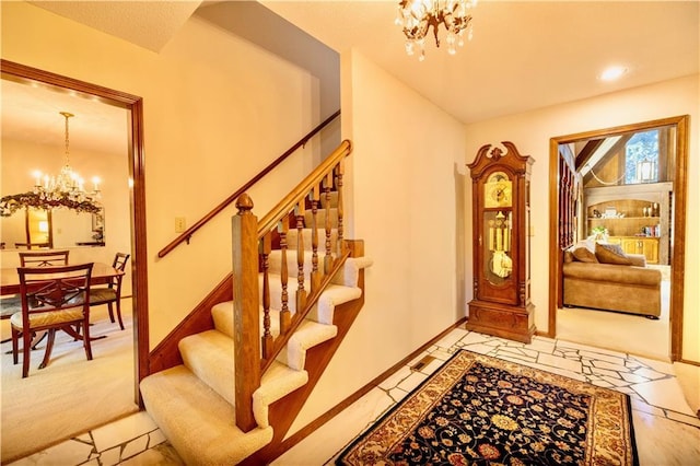 401 E 129th Ter, Kansas City, MO 64145 - entryway with a chandelier, stairs, and baseboards