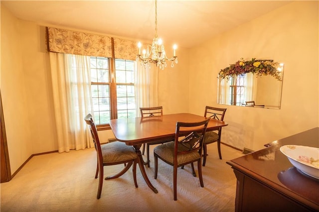 401 E 129th Ter, Kansas City, MO 64145 - dining area with a chandelier, light colored carpet, and baseboards