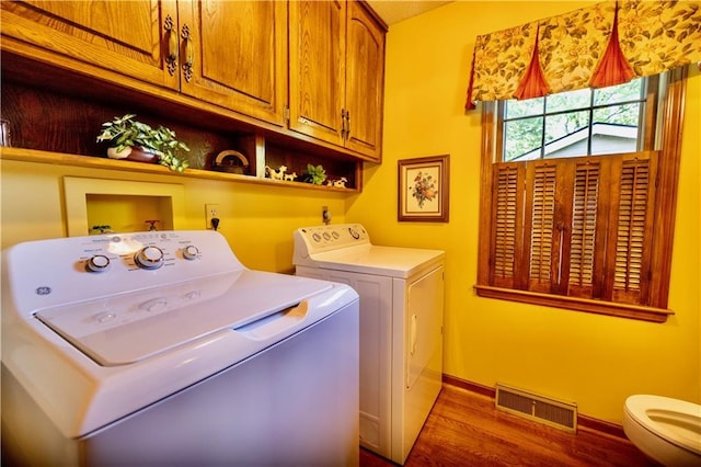 401 E 129th Ter, Kansas City, MO 64145 - laundry area with separate washer and dryer, dark wood finished floors, and baseboards