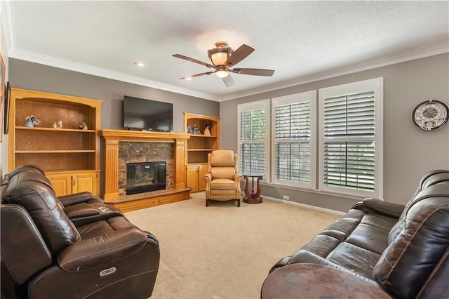 11415 Oakview Dr, Lenexa, KS 66215 - living area featuring a ceiling fan, crown molding, carpet, a glass covered fireplace, and baseboards