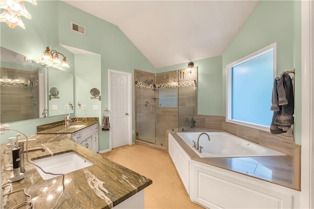 11415 Oakview Dr, Lenexa, KS 66215 - bathroom with vanity, a stall shower, vaulted ceiling, and a garden tub