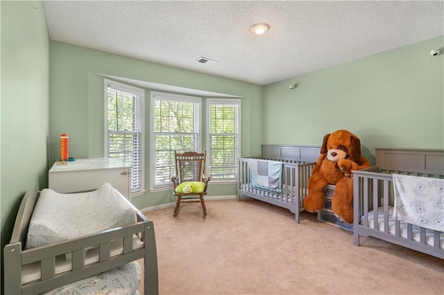 11415 Oakview Dr, Lenexa, KS 66215 - carpeted bedroom with a textured ceiling and baseboards