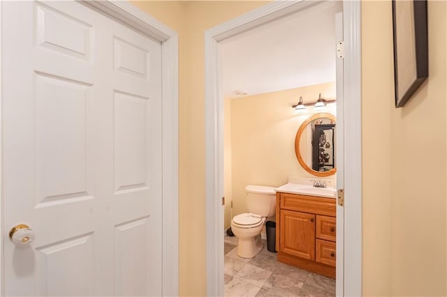 11415 Oakview Dr, Lenexa, KS 66215 - half bathroom featuring marble finish flooring, vanity, and toilet