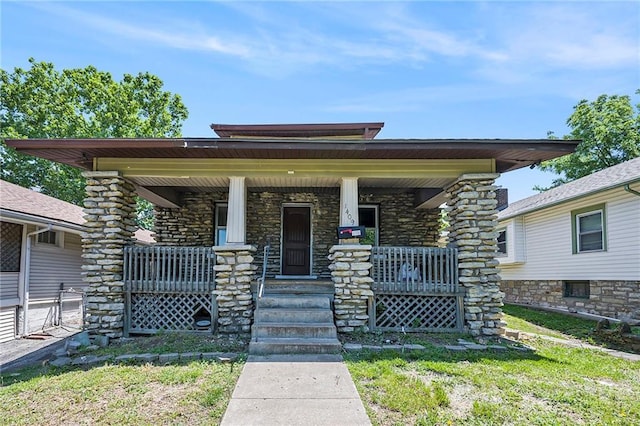 1409 N 24th St, Kansas City, KS 66102 - view of front of home with covered porch and stone siding