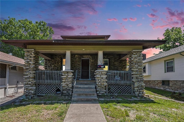1409 N 24th St, Kansas City, KS 66102 - view of front of house featuring a porch and stone siding