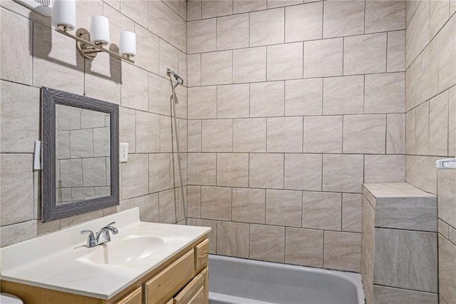 1409 N 24th St, Kansas City, KS 66102 - full bath featuring vanity, bathing tub / shower combination, and tile walls