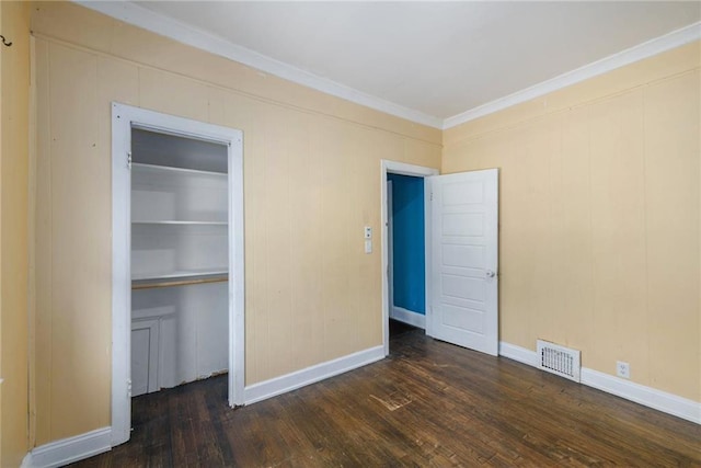 1409 N 24th St, Kansas City, KS 66102 - unfurnished bedroom featuring wood-type flooring, ornamental molding, a closet, and baseboards